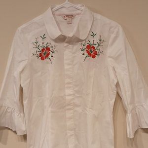 White shirt with embroidery and flare sleeves